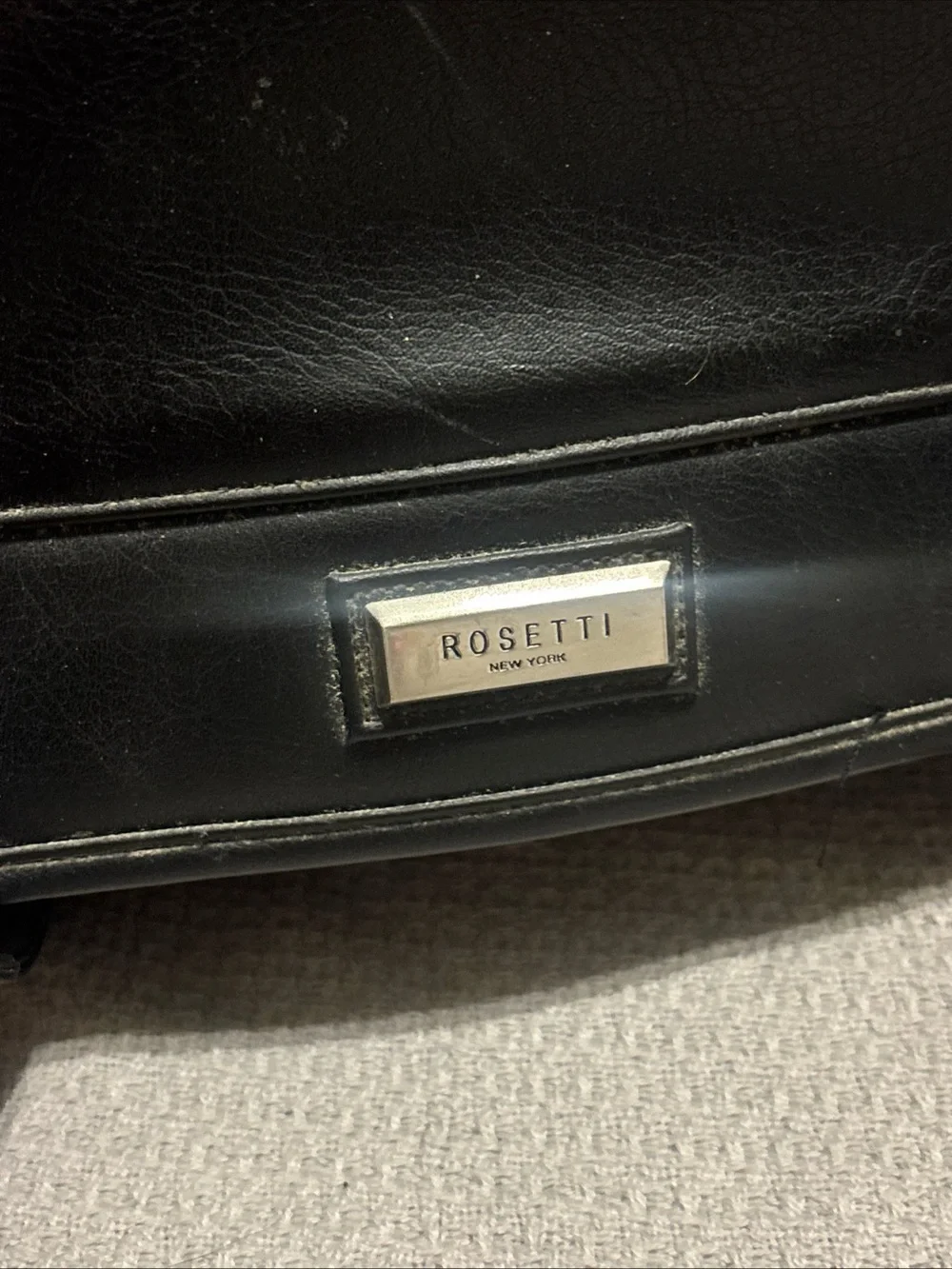 Rosetti Black Leather Messenger Briefcase with Buckle Accents